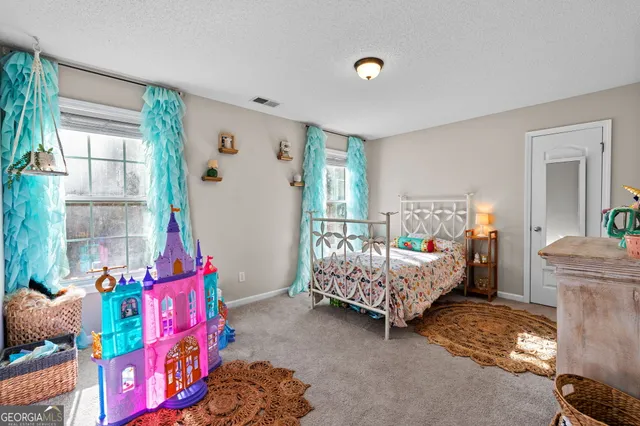 a bed room with furniture and a window