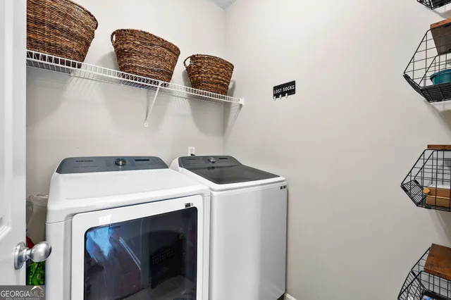 a utility room with dryer and washer