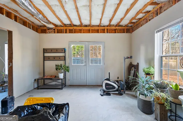a view of a livingroom with furniture and a window
