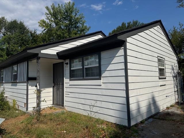 380 Elder Road Memphis, TN 38109 - Photo 2 of 9 a view of house with a large window and wooden fence