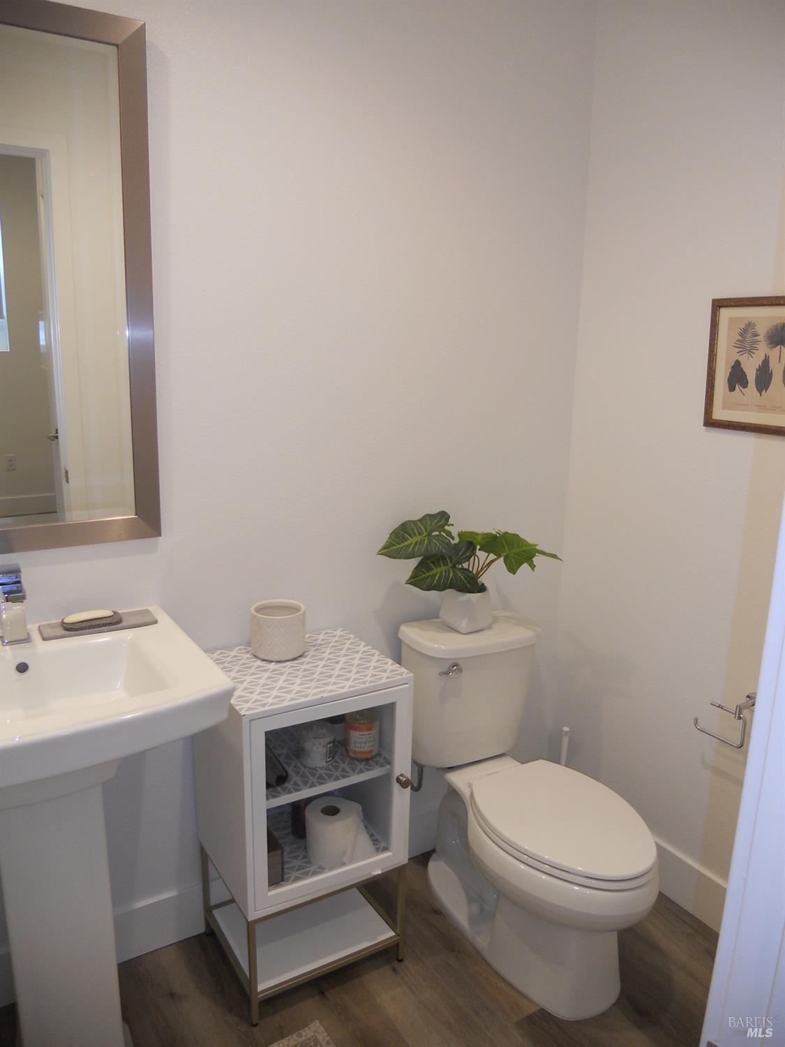 451 Semillon Lane Santa Rosa, CA 95403 - Photo 11 of 23 a bathroom with a toilet sink and mirror