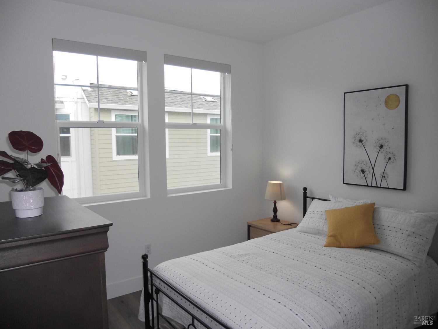 451 Semillon Lane Santa Rosa, CA 95403 - Photo 19 of 23 a bedroom with a bed and a window