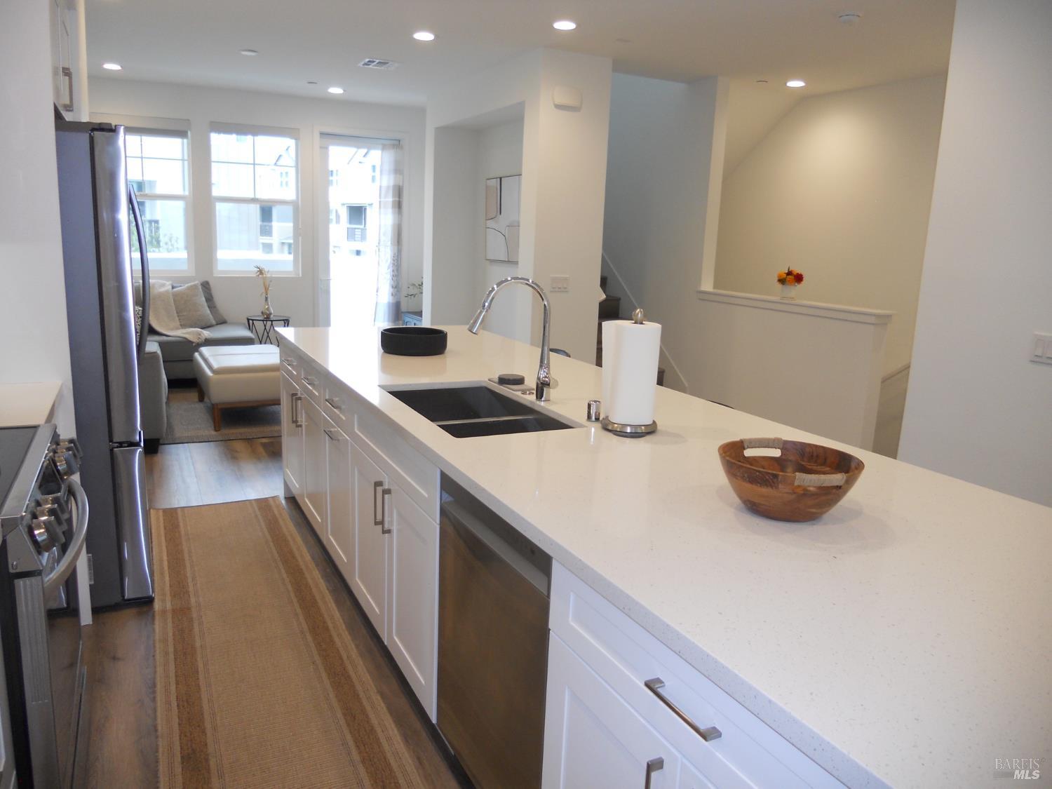 451 Semillon Lane Santa Rosa, CA 95403 - Photo 5 of 23 a kitchen with sink a stove and cabinets