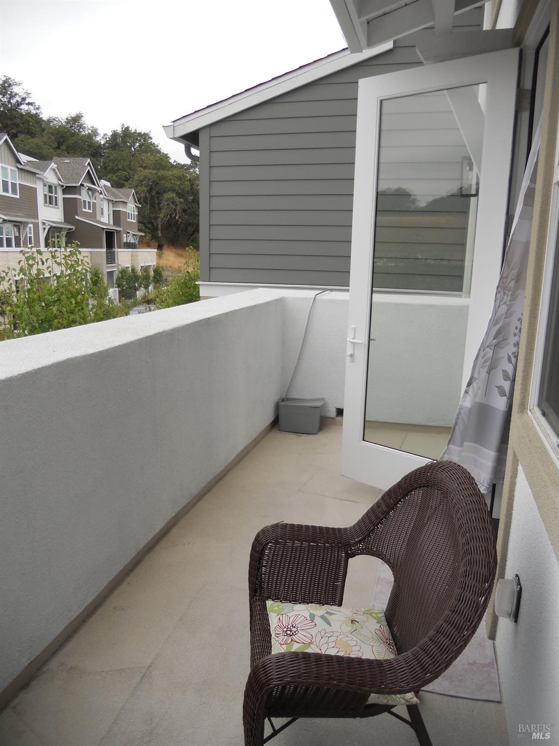451 Semillon Lane Santa Rosa, CA 95403 - Photo 9 of 23 a balcony with table and chairs