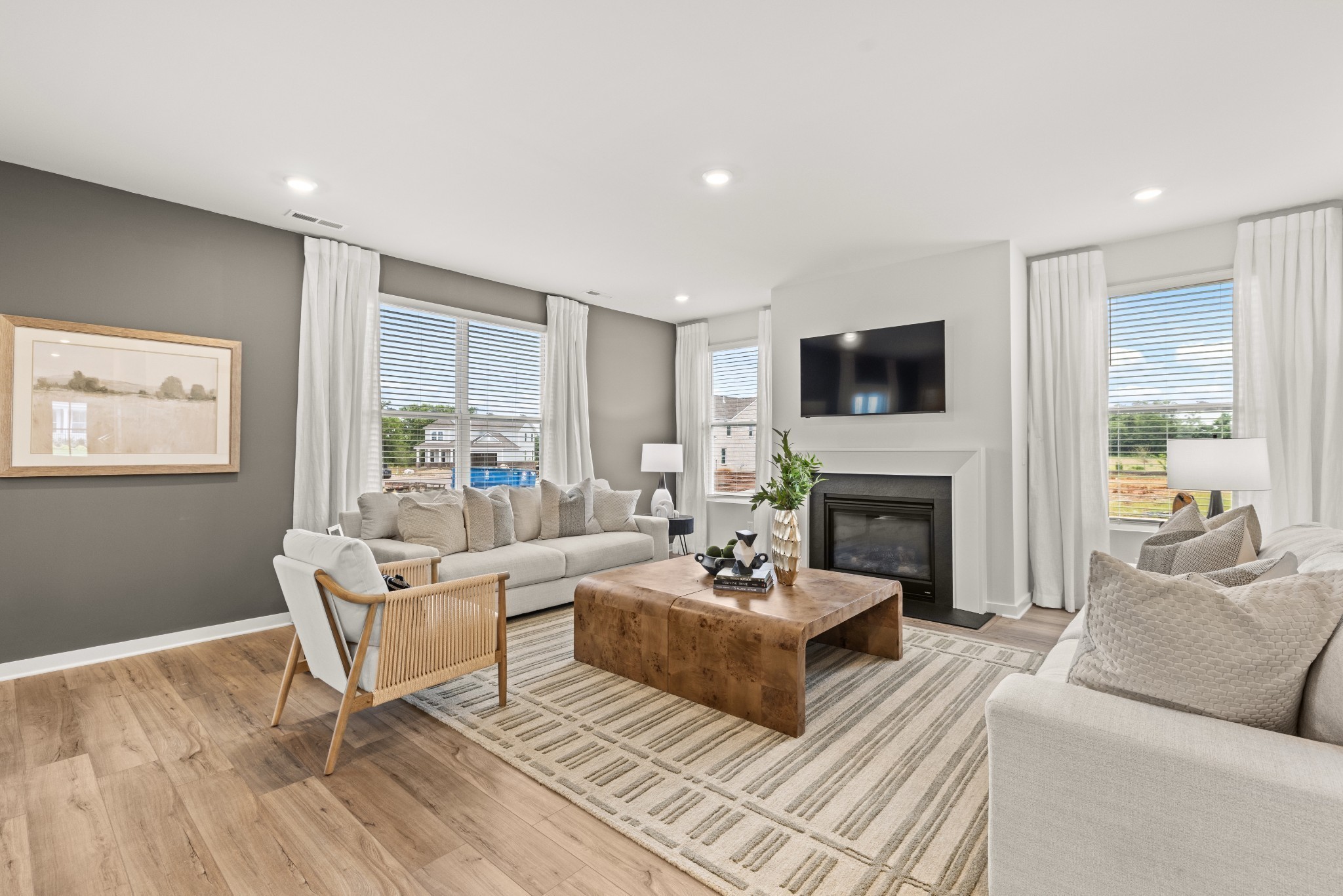 7447 Cox Run Drive Fairview, TN 37062 - Photo 22 of 69 a living room with furniture a fireplace and a flat screen tv