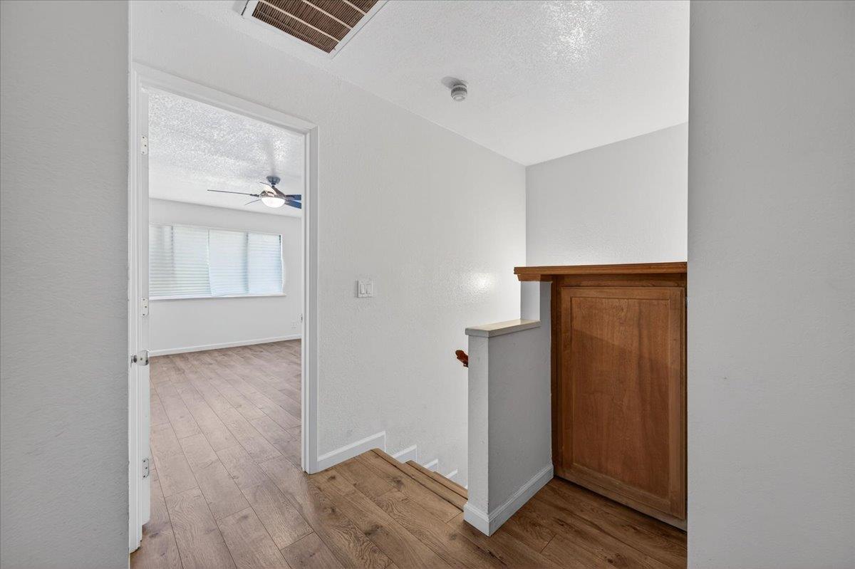 4875 North Backer Avenue, Unit 143 Fresno, CA 93726 - Photo 14 of 27 an empty room with wooden floor