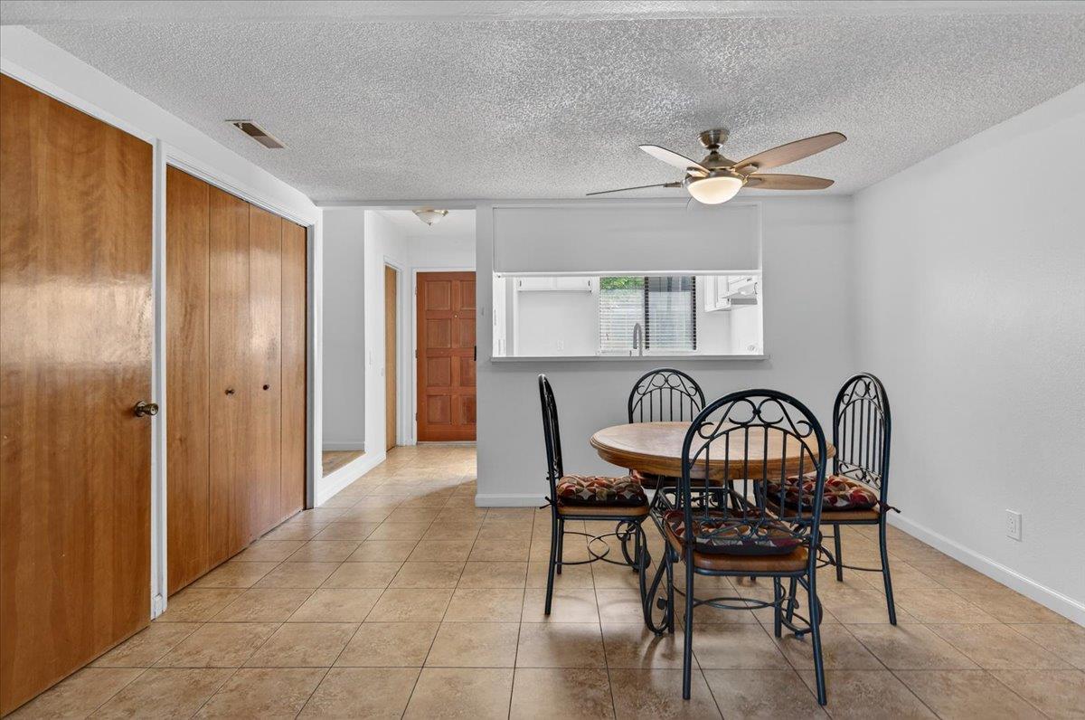 4875 North Backer Avenue, Unit 143 Fresno, CA 93726 - Photo 10 of 27 a view of a dining room that has a table and chairs