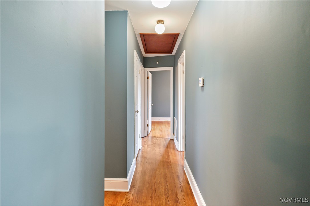 1560 Cumberland Road Farmville, VA 23901 - Photo 3 of 20 a view of a hallway with wooden floor and a bathroom