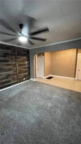 a view of an empty room with a fireplace