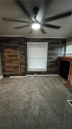 a view of a livingroom with an empty space and garage