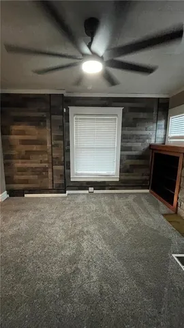 a view of a livingroom with an empty space and garage