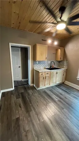 a view of a livingroom with wooden floor