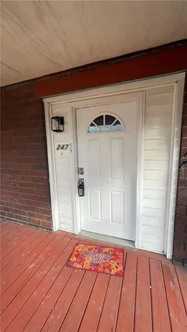 a view of a livingroom with wooden floor