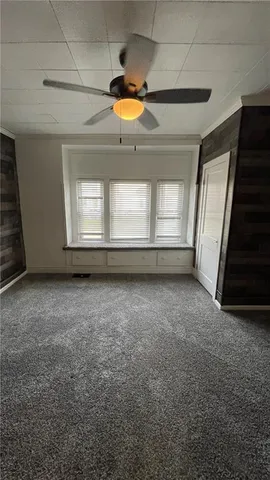 an empty room with a empty space and windows