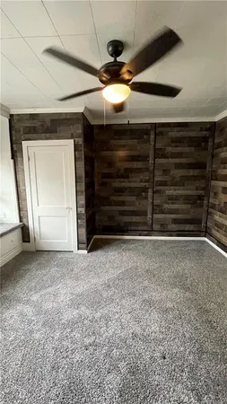 a view of an empty room and a window