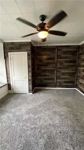 a view of an empty room and a window