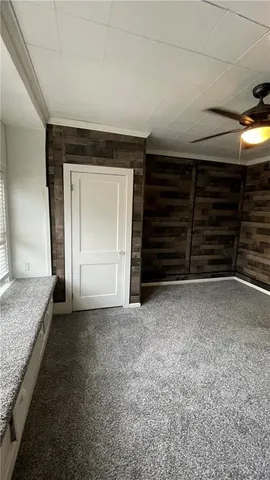 a view of an empty room and fire place