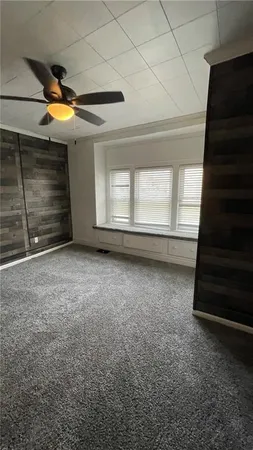 a view of an empty room with a fireplace