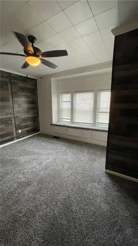 a view of an empty room with a fireplace