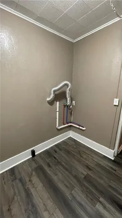 an empty room with wooden floor