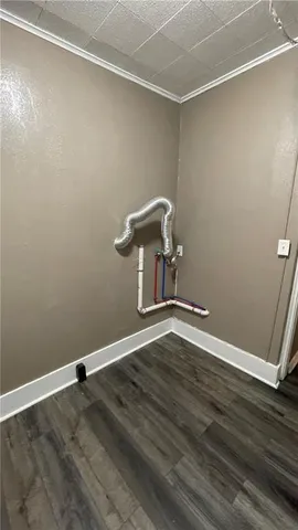 an empty room with wooden floor