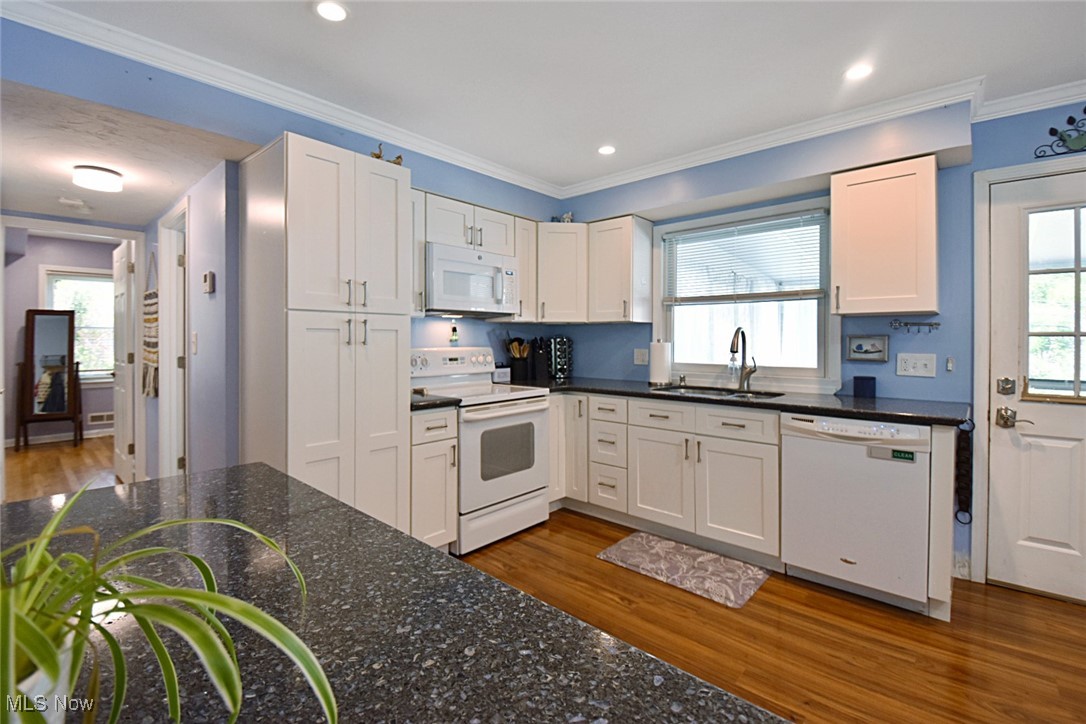 1388 Ford Road Lyndhurst, OH 44124 - Photo 6 of 39 Kitchen with hardwood / wood-style floors, white appliances, sink, and plenty of natural light
