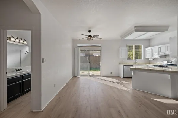 a view of a kitchen cabinets and wooden floor