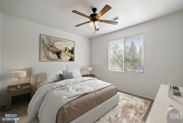 a bedroom with bed and a window