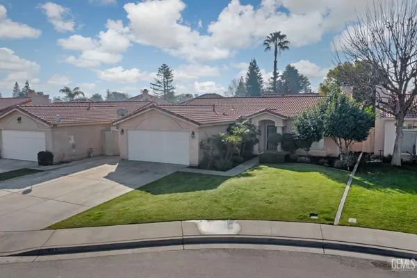 a view of house with backyard outdoor seating and entertaining space