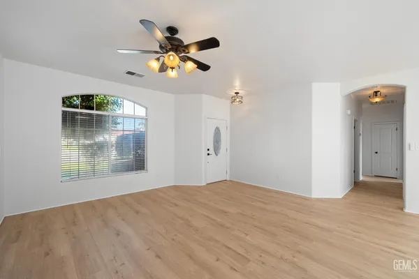a view of an empty room with a window
