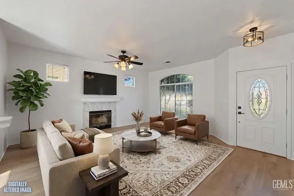 a living room with furniture and a fireplace