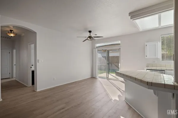 a very nice looking room with a large window and wooden floor