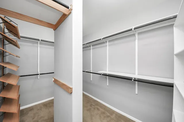 a view of an empty room with shelves