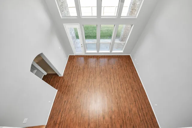 a view of wooden floor in an empty room
