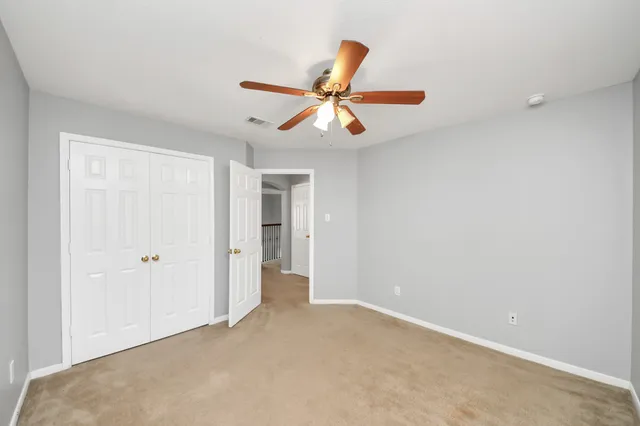 a view of a chandelier fan in a room