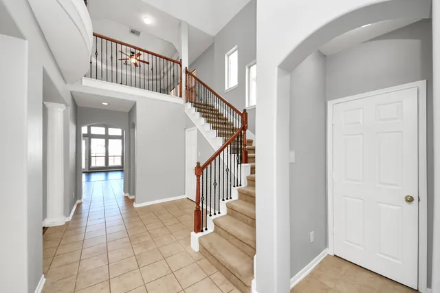 a view of an entryway with wooden floor