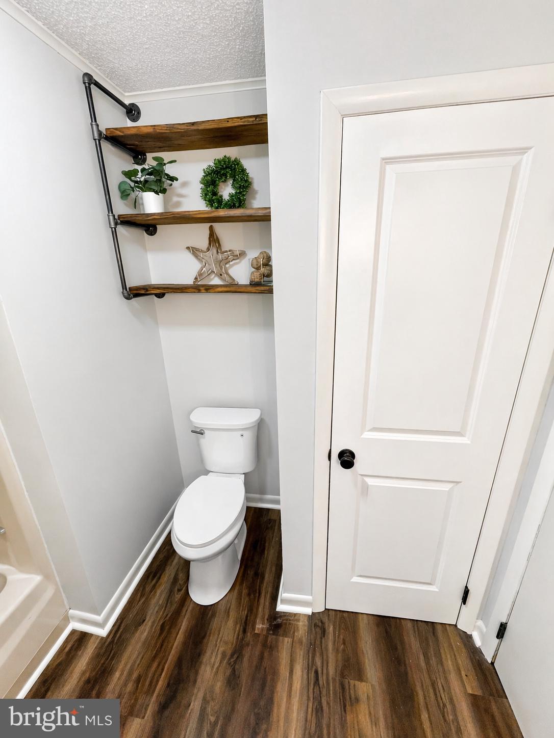 18 Calgary Avenue Ocean View, DE 19970 - Photo 11 of 14 a bathroom with a toilet and a shower