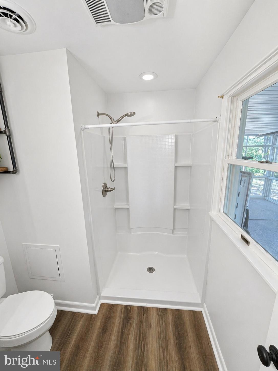 18 Calgary Avenue Ocean View, DE 19970 - Photo 10 of 14 a bathroom with a toilet and a shower