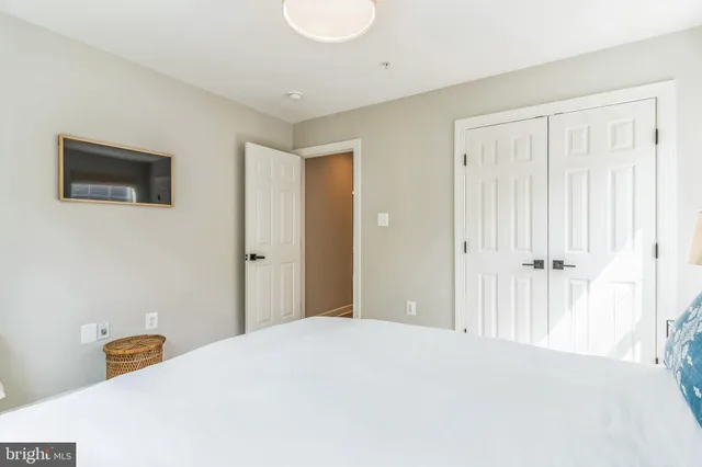 a bedroom with a bed and a area