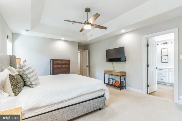 a bathroom with a tub a sink and a window