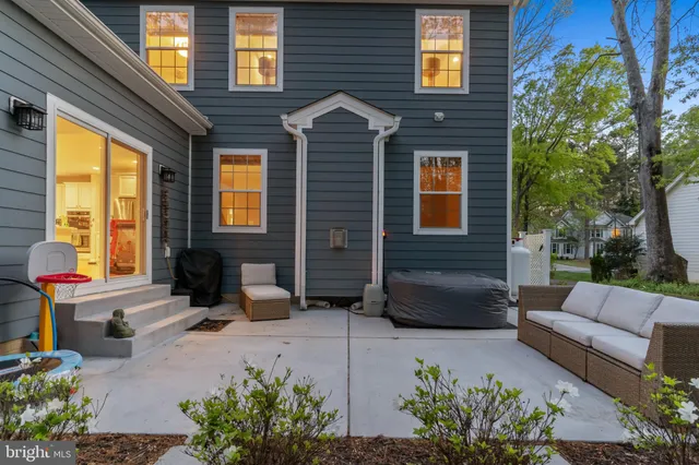 a backyard of a house with outdoor seating
