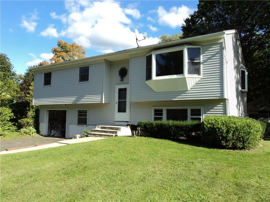 4 Kingswood Road Danbury, CT 06811 - Photo 1 of 1 a front view of a house with a yard and garage
