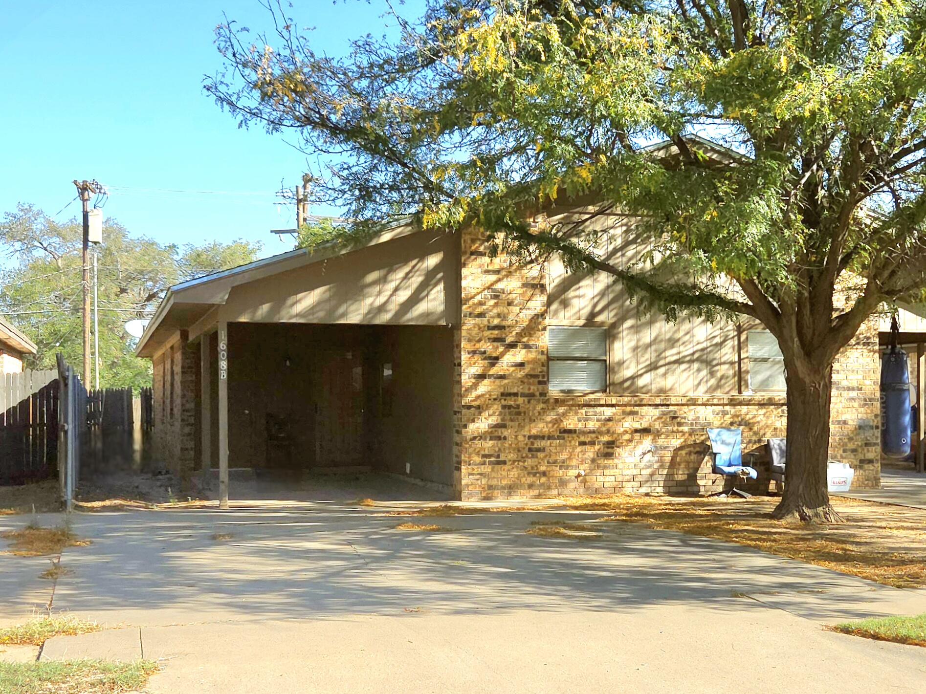 a view of a house with a tree