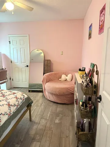 a bedroom with a bed and a dresser