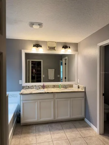 a kitchen with a stove and a refrigerator