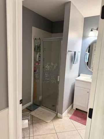 a bathroom with a shower and toilet