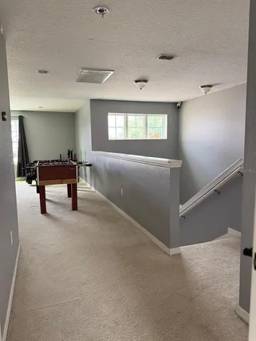 a view of a livingroom with furniture and windows