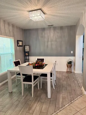 a view of a dining room with furniture
