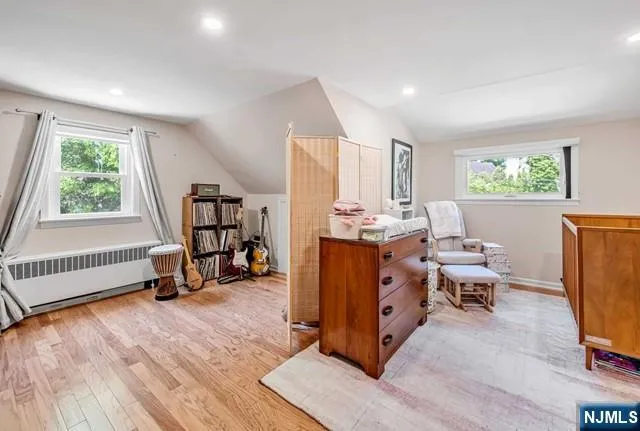 a room with furniture a window and gym equipment