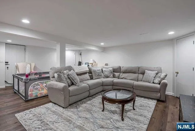 a living room with furniture a couch and a coffee table